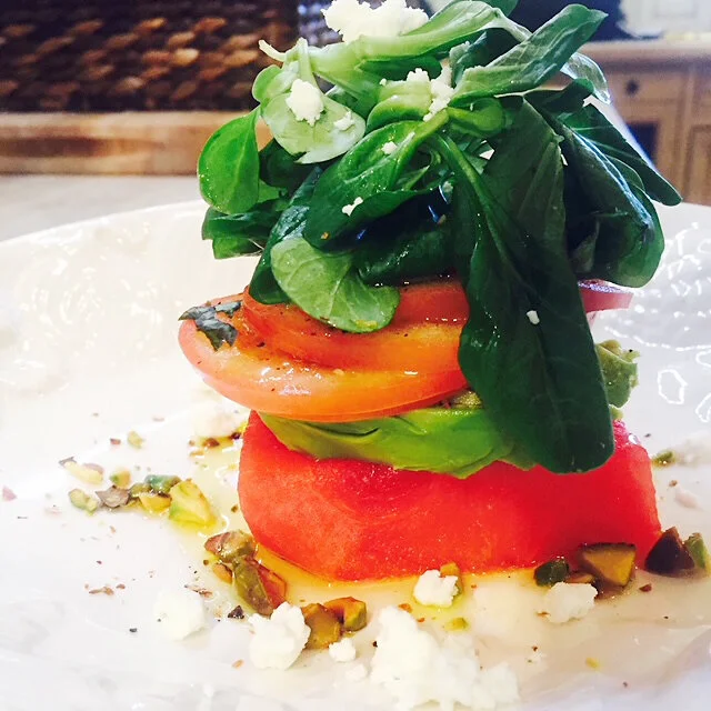 Watermelon Salad with avocado, roma tomatoes, and mache with feta and pistachios 