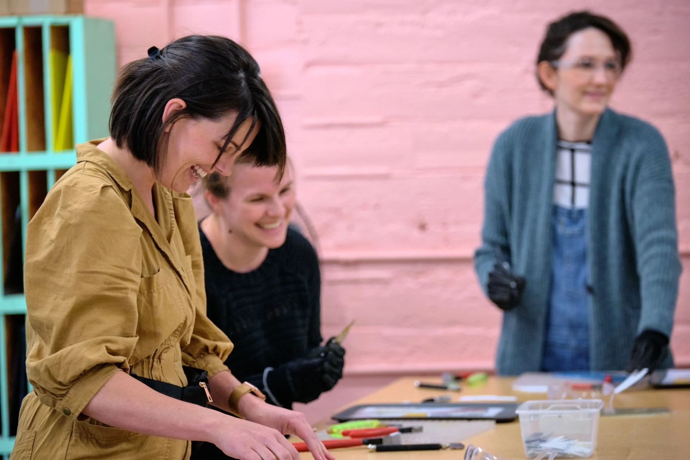Students enjoying a beginner stained glass class at ATL Glassworks in Atlanta GA