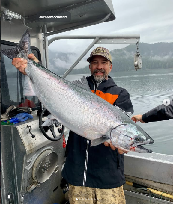 Kenny Karas, Chrome Chasers fall fishing guide, holding a king salmon on the Chromagnum in Wrangell, Alaska