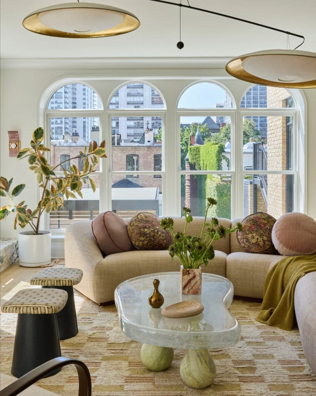 There is something so refreshing about this interior by @bishopthestudio . Every element feels considered, yet the space remains effortless, layered, and full of life.

Floating above the living space, the Palanquin Duo Mobile by C&eacute;line Wright