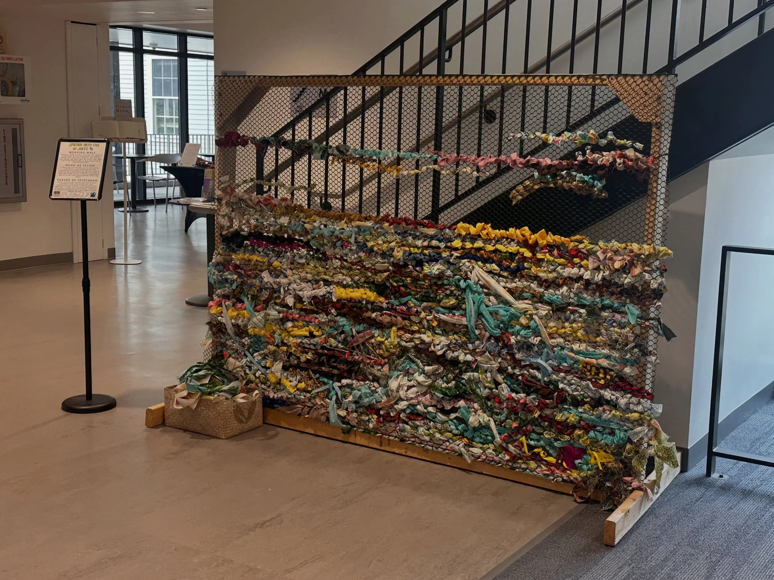 If you haven&rsquo;t visited the Spring into the Arts weaving wall at @sawyerfreelibrary, you gotta go check it out and add your own piece! We added another panel today and it&rsquo;s already filling up&hellip;