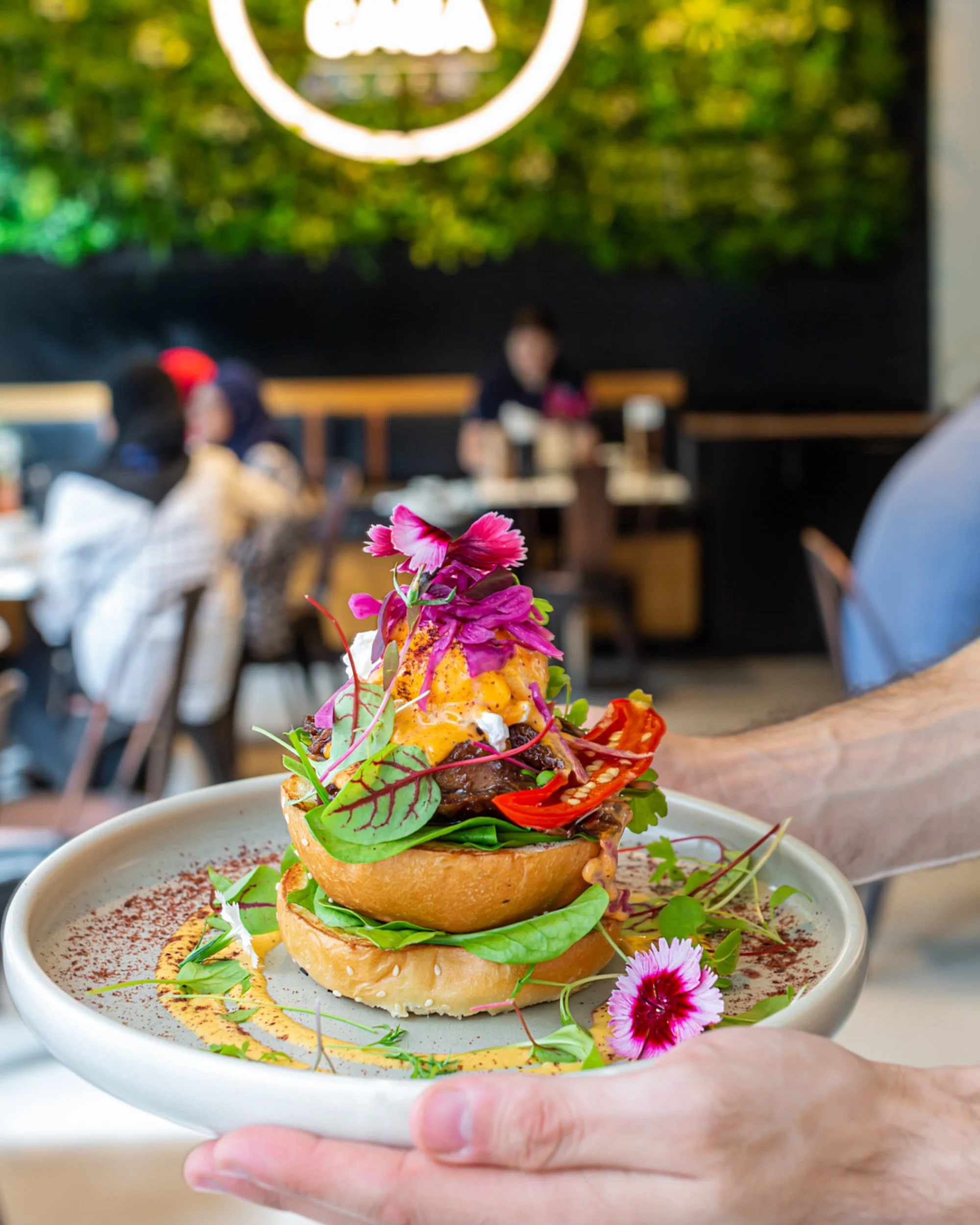 MiCasa_Colourful_Topped_Burger_In_Hands.jpg
