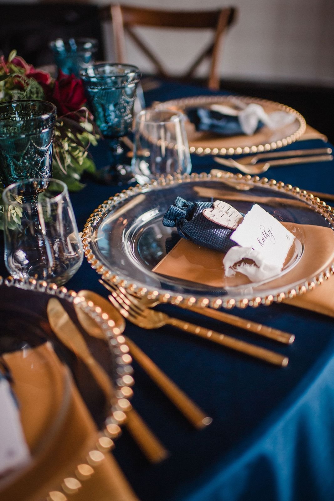 Place settings at Bearspaw Golf Course wedding