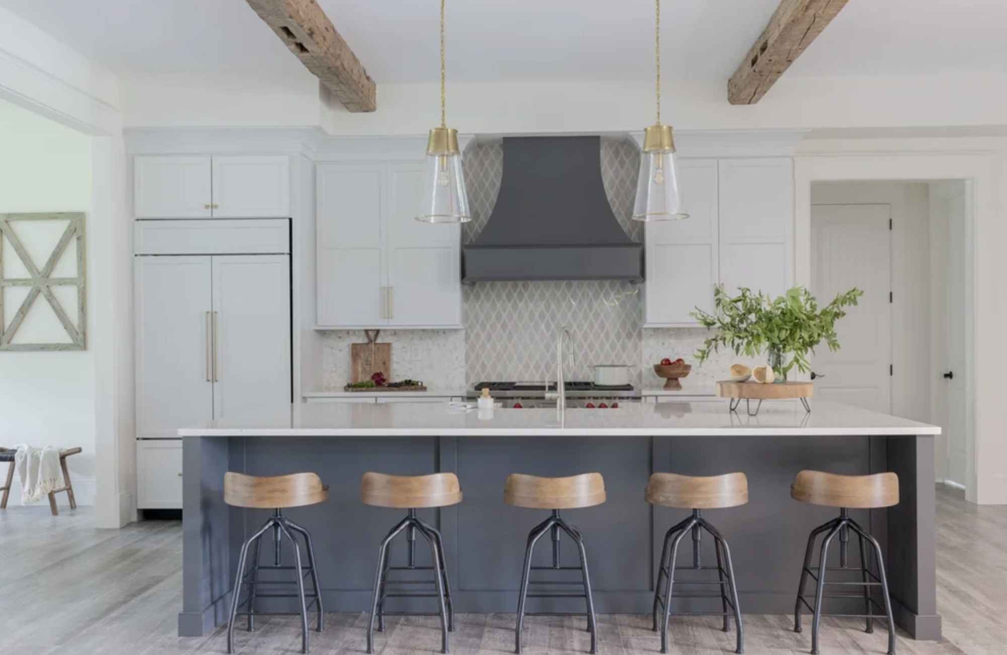 ironwood-studio-co-new-england-advantages-of-a-design-build-firm-coastal-kitchen-with-blue-island-white-cabinets-ceiling-beams-custom-range-hood-timeless.jpg