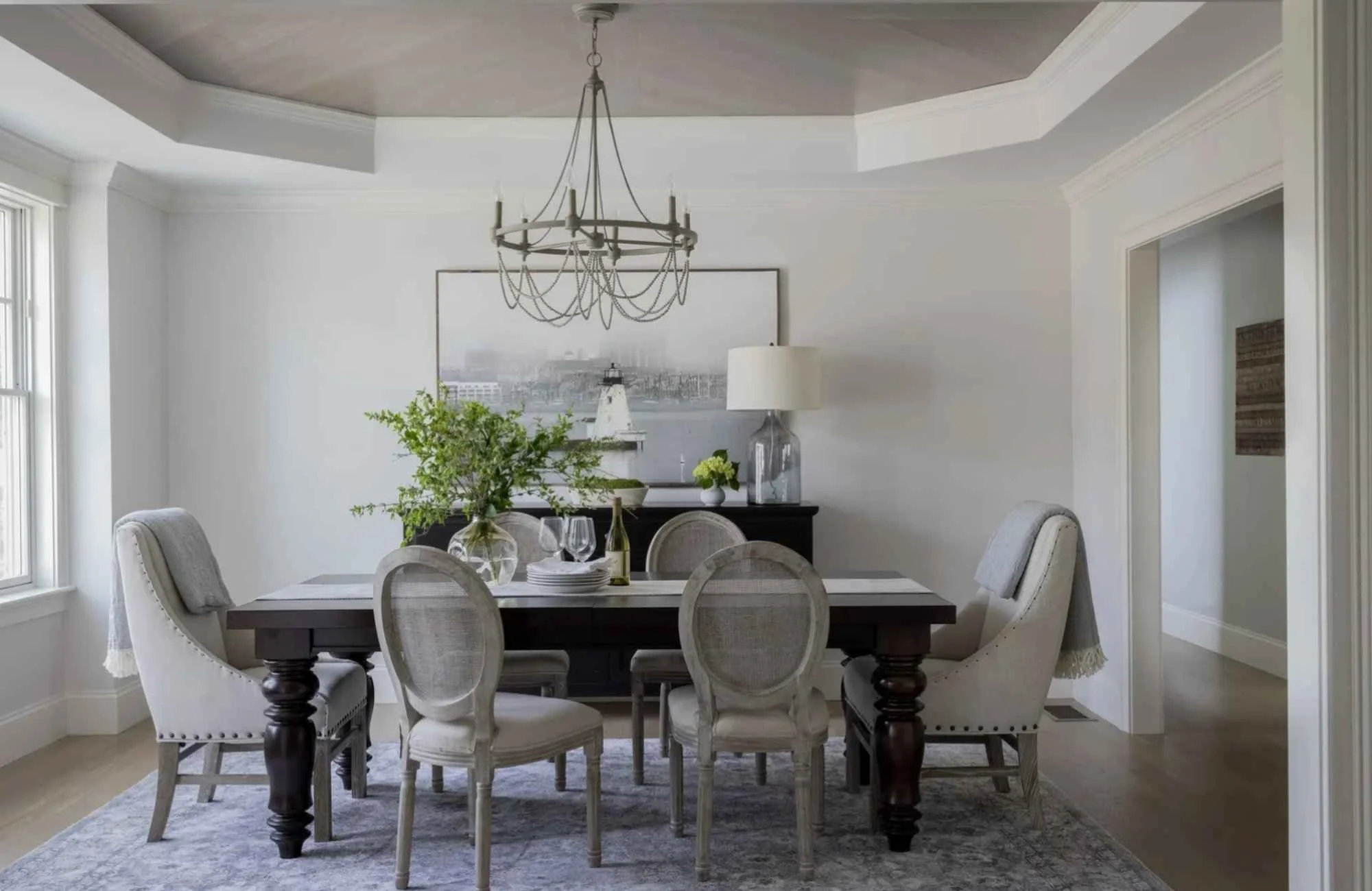 ironwood-studio-new-england-custom-home-interior-dining-room-with-traditional-chairs-neutral-colors-dark-wood-table-wood-ceiling-detail-coastal-new-build.jpg