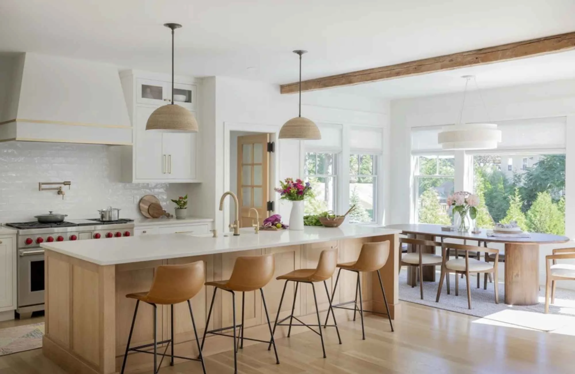 ironwood-studio-fairhaven-ma-custom-home-interior-new-kitchen-warm-earth-tones-natural-wood-leather-bar-stools-large-island-sunny-dining-area-timeless.jpg