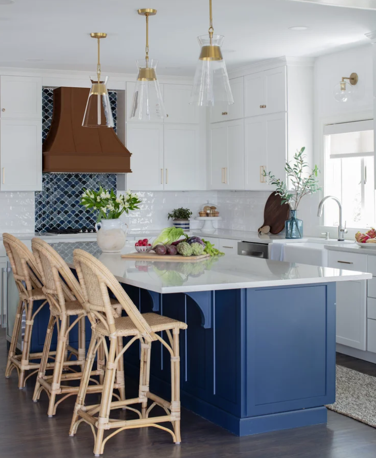 ironwood-studio-cape-cod-ma-natural-vs-engineered-stone-countertops-white-and-blue-kitchen-cabinets-custom-range-hood-coastal-timeless-design.png