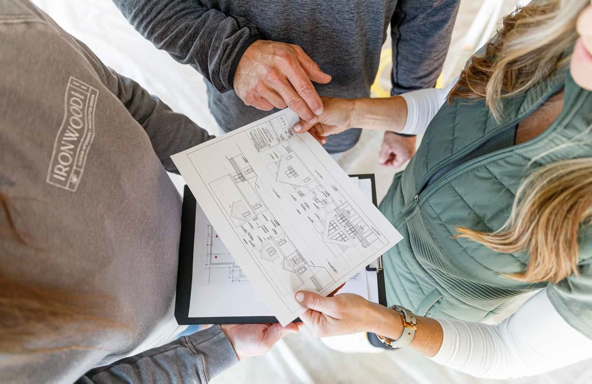 full-service-interior-design-barrington-ri-designer-trade-relationships-design-team-collaborating-looking-at-technical-home-drawings-together.jpg