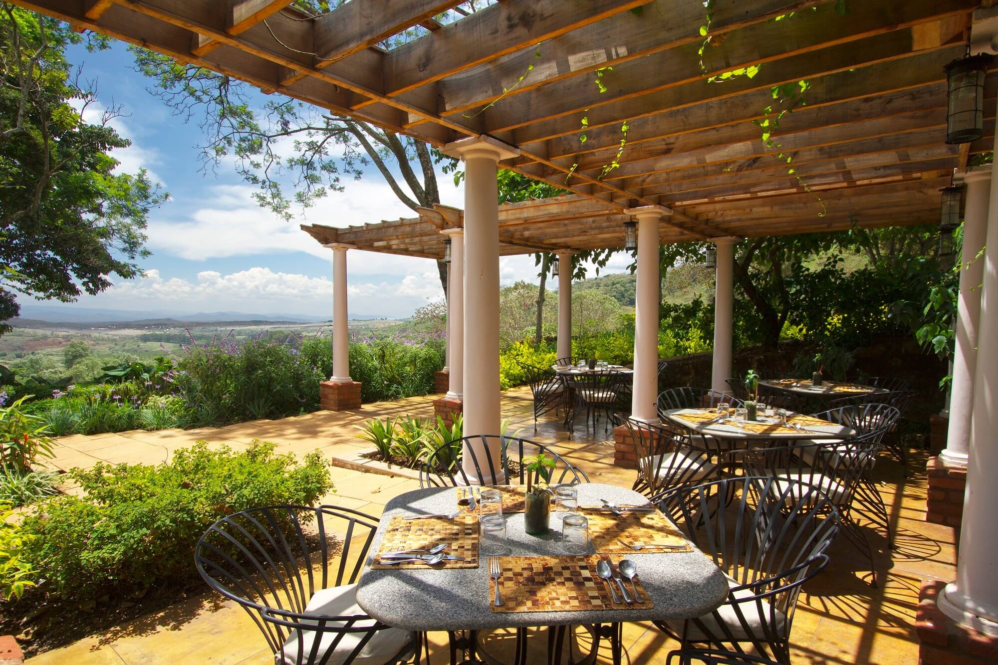 Miru_Adventures_Tanzania_Coffee_WildlifeSafari_Gibb's Farm - Outdoor seating at the restaurant.jpg