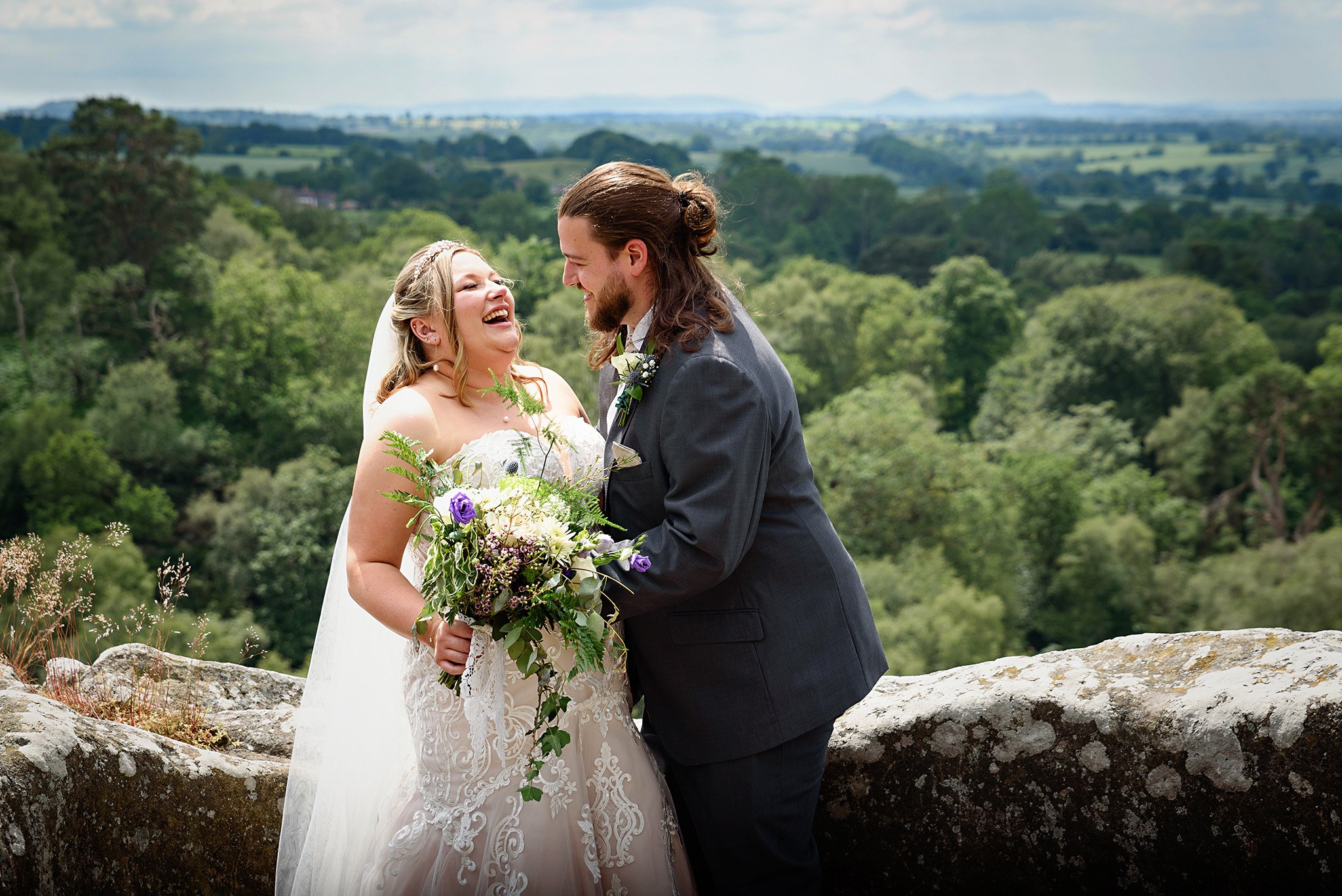  Bride and groom laughing in a wedding photo at Hawkstone Park 