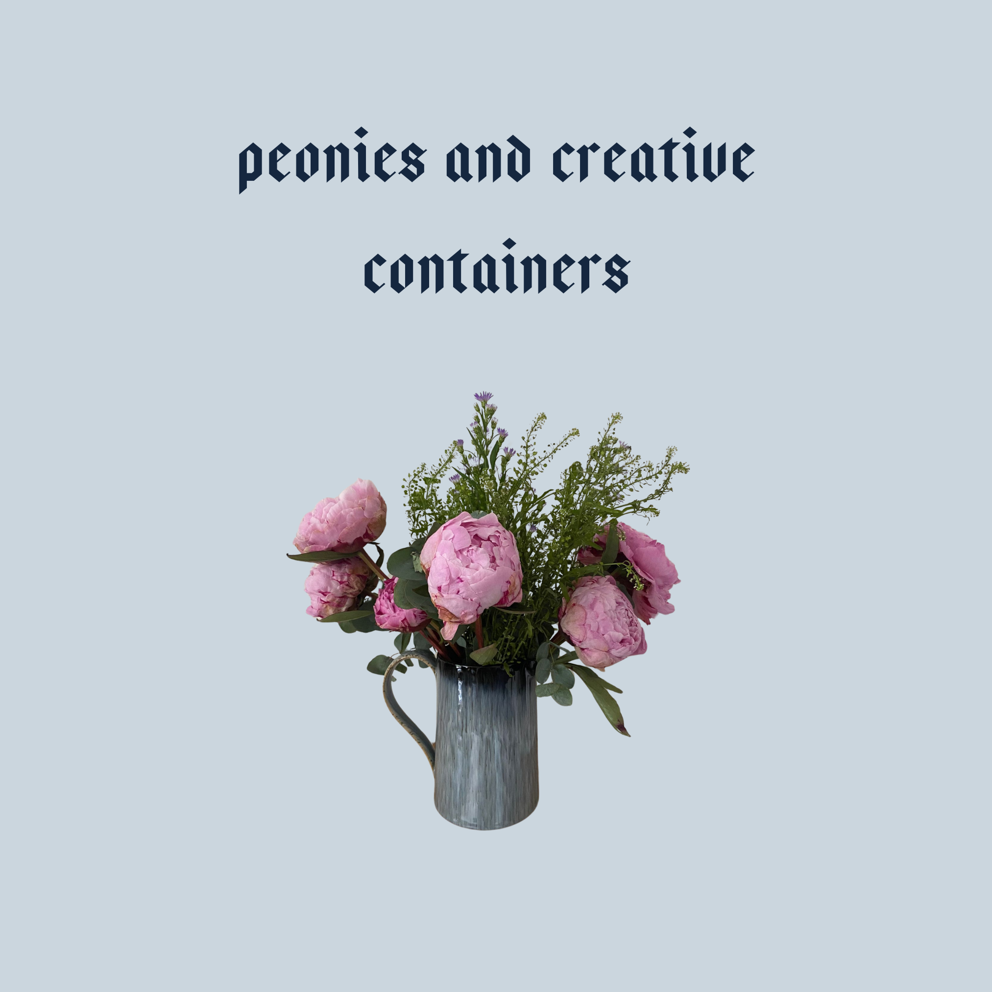 A jug glazed in light and dark blues containing a spray of pink peonies, with light green foliage.