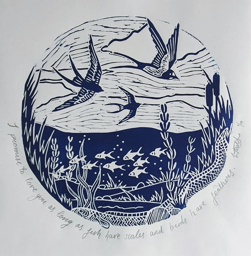 A lino print of swallows swooping over a shallow river where fish swim and eels lurk, printed in blue ink on white paper.