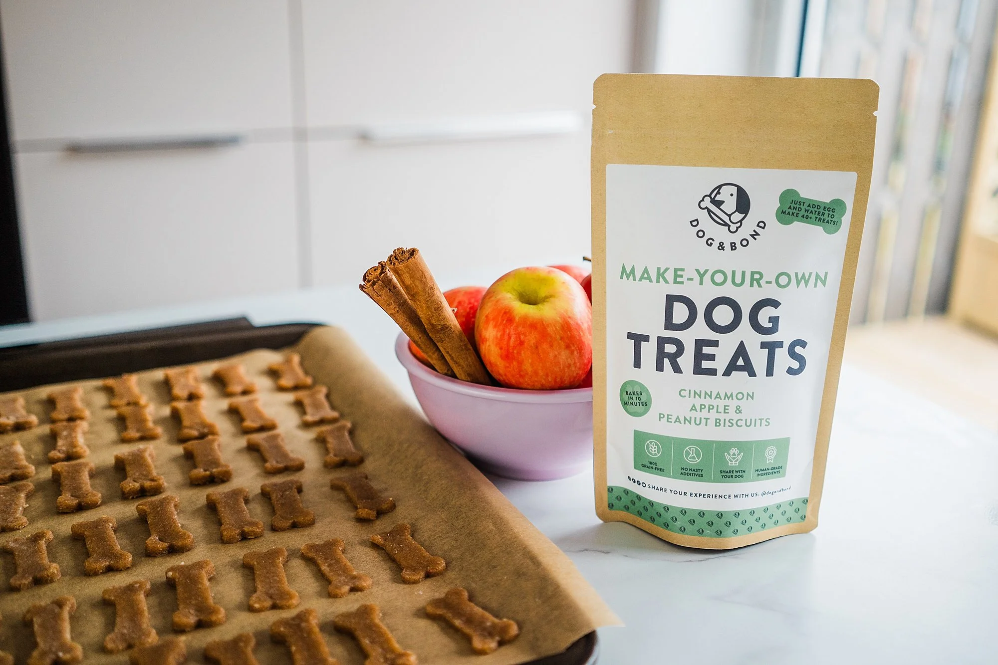 Dog & Bond make-your-own dog treat mix with baked bone-shaped biscuits, apples and cinnamon