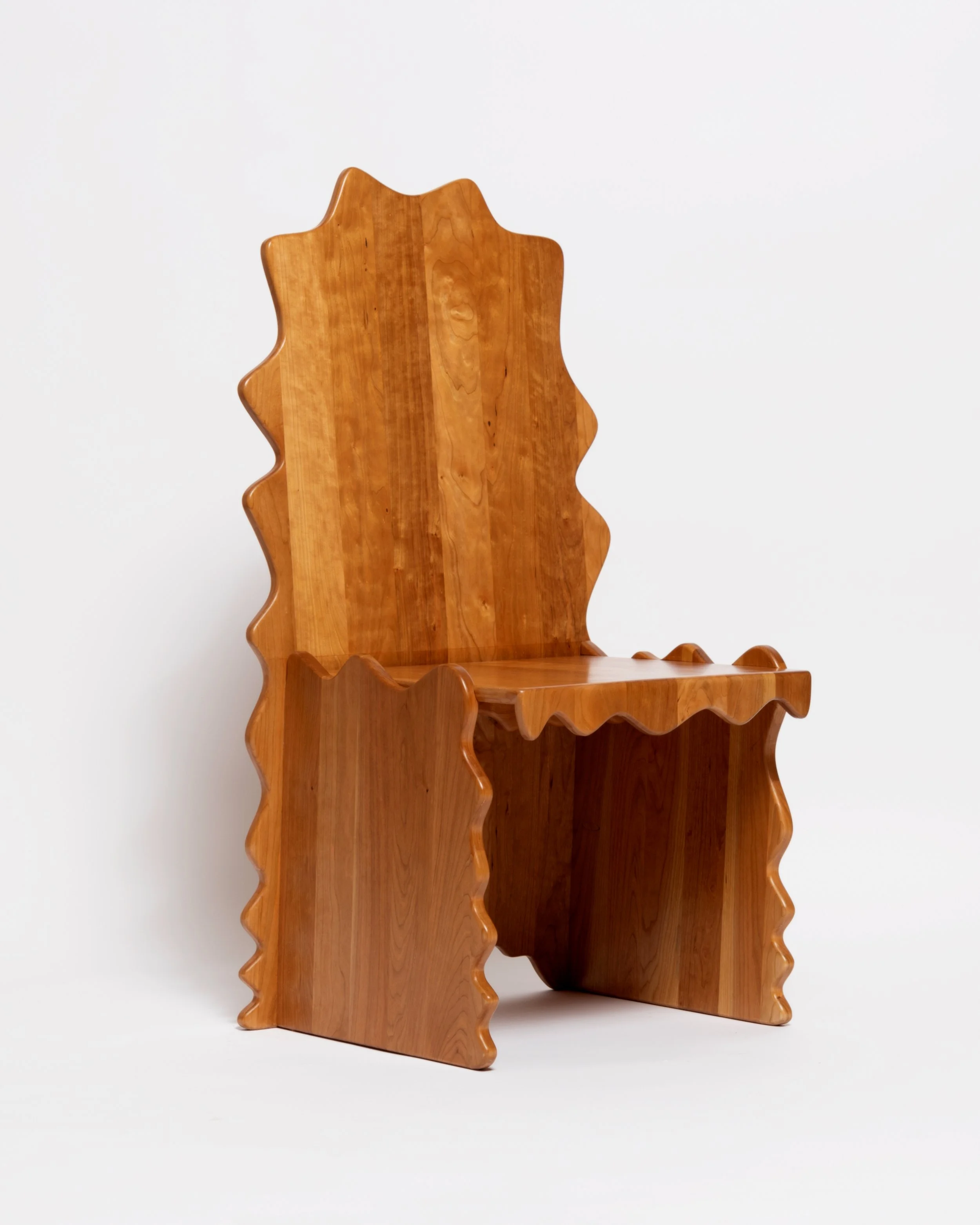 A wooden corner shelf with a wavy, scalloped edge design set against a plain white background.