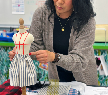 close up of mini form draped with mini dress.png