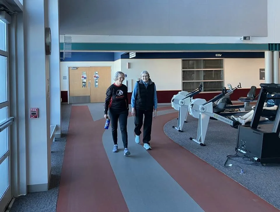 Irene & Marty staying warm by moving at the fitness center