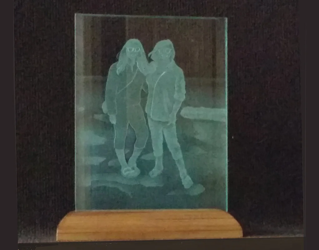 two-girls-sandblasted-in-glass-moodlight-from-photograph.jpg