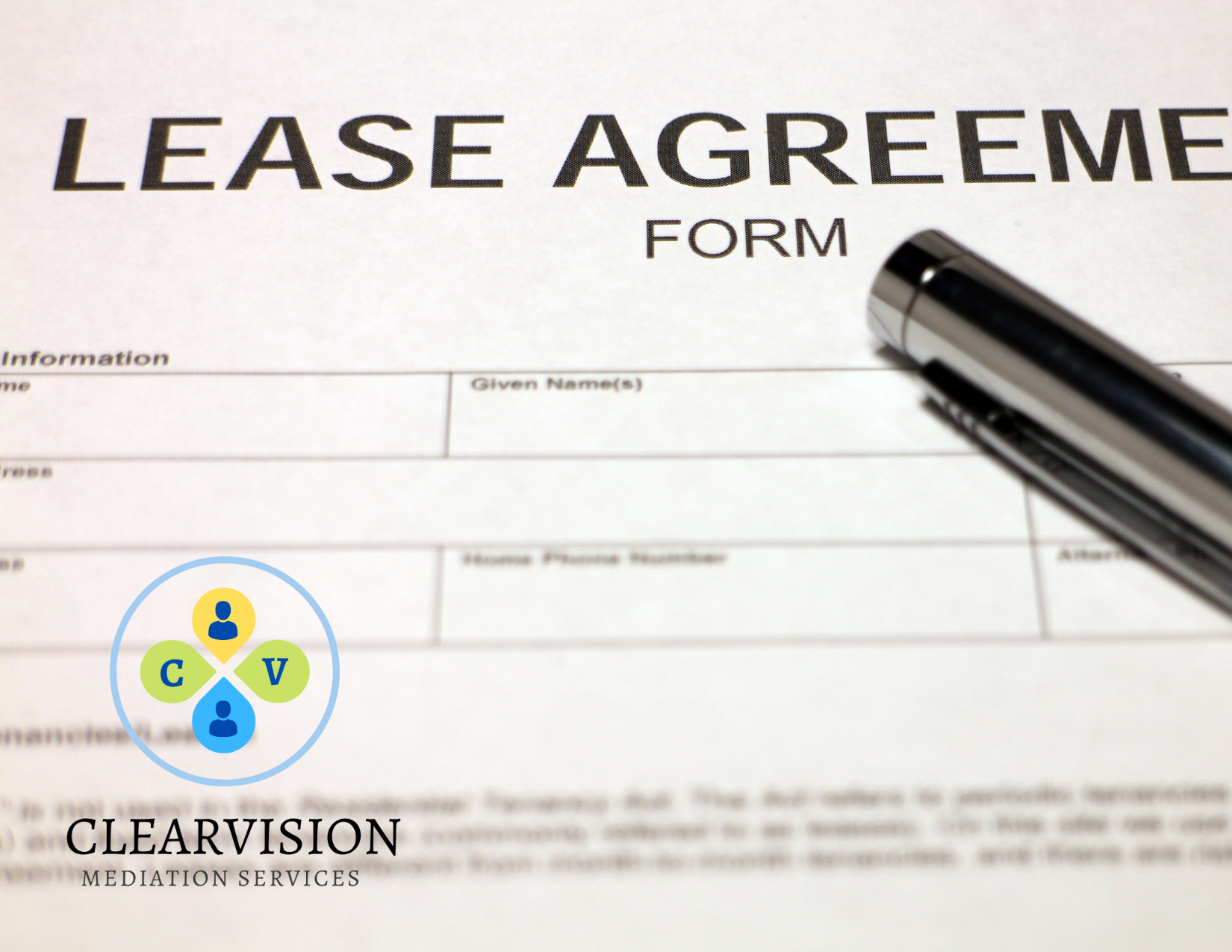 A pen lays on top of a paper document stating "lease agreement."