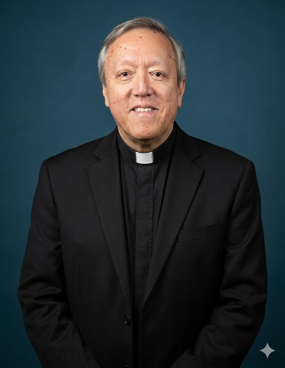 A middle-aged man wearing a black clergy suit with a white clerical collar posing against a dark teal background, smiling at the camera.