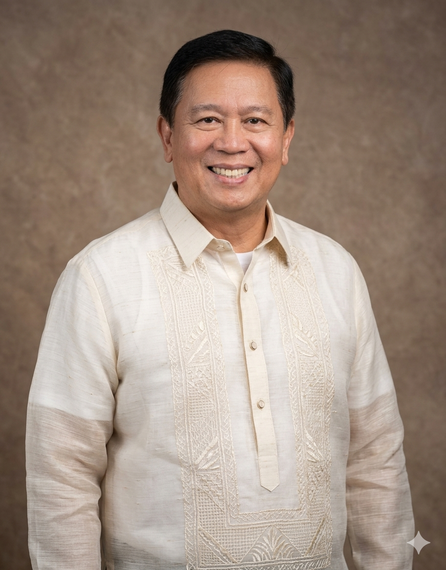 A smiling man of Asian descent wearing a traditional beige Filipino barong tagalog, standing against a brown background.