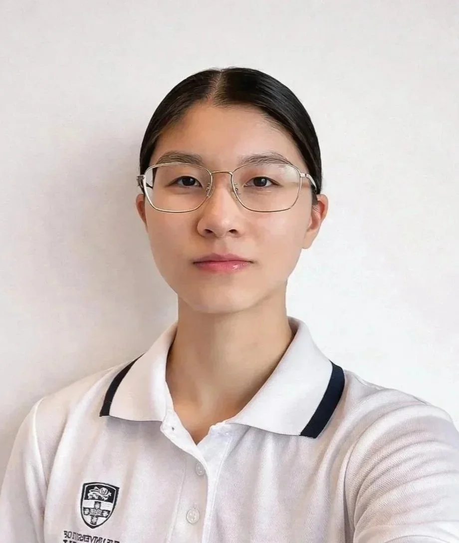 Asian female black hair in ponytail and glasses