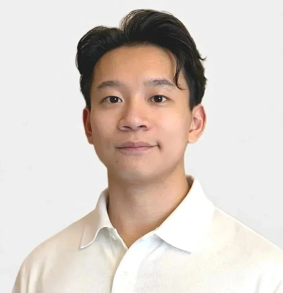 Asian male with black sleek hair and white shirt
