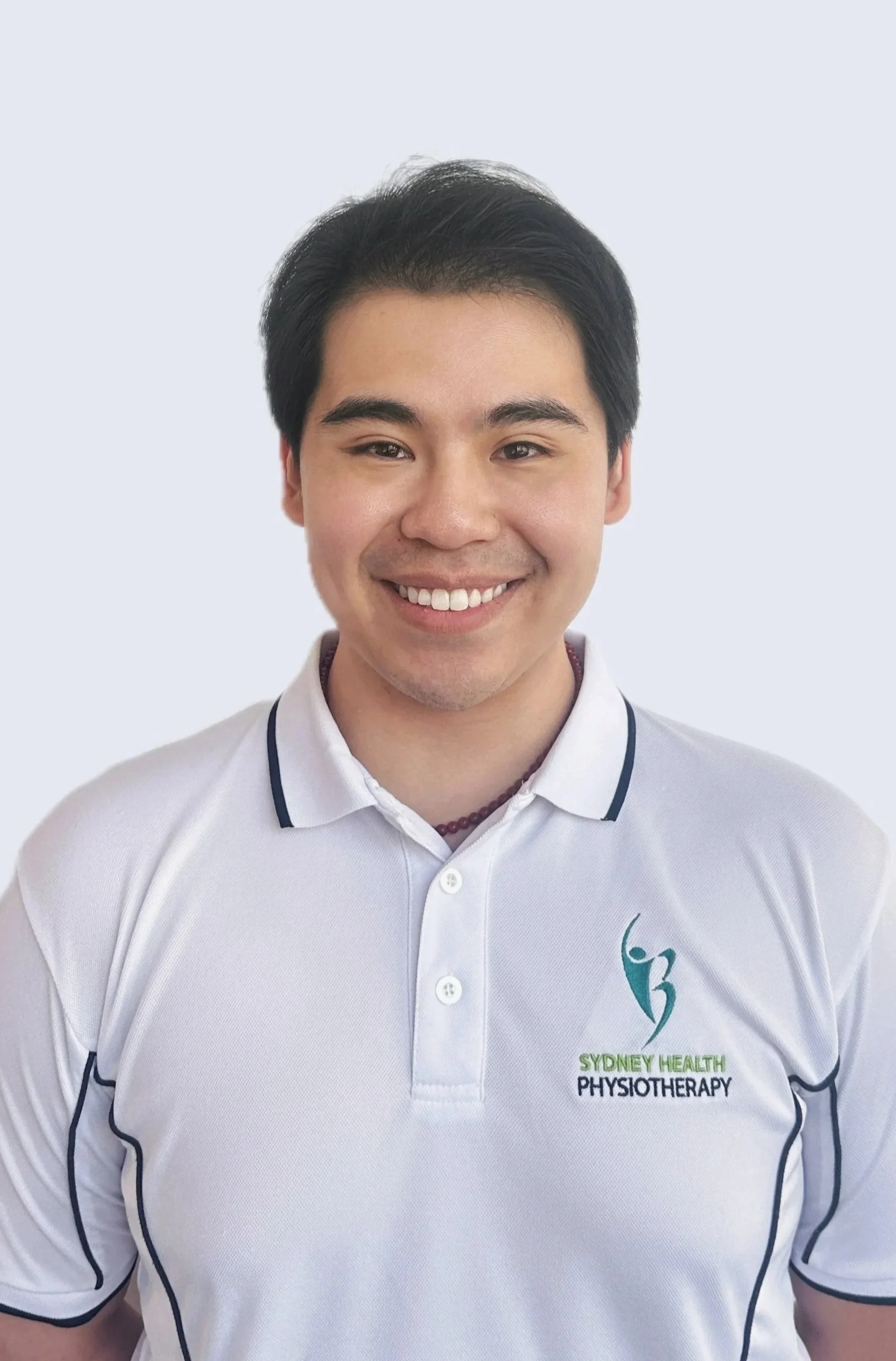 A man with a slight fringe and thick eye brows