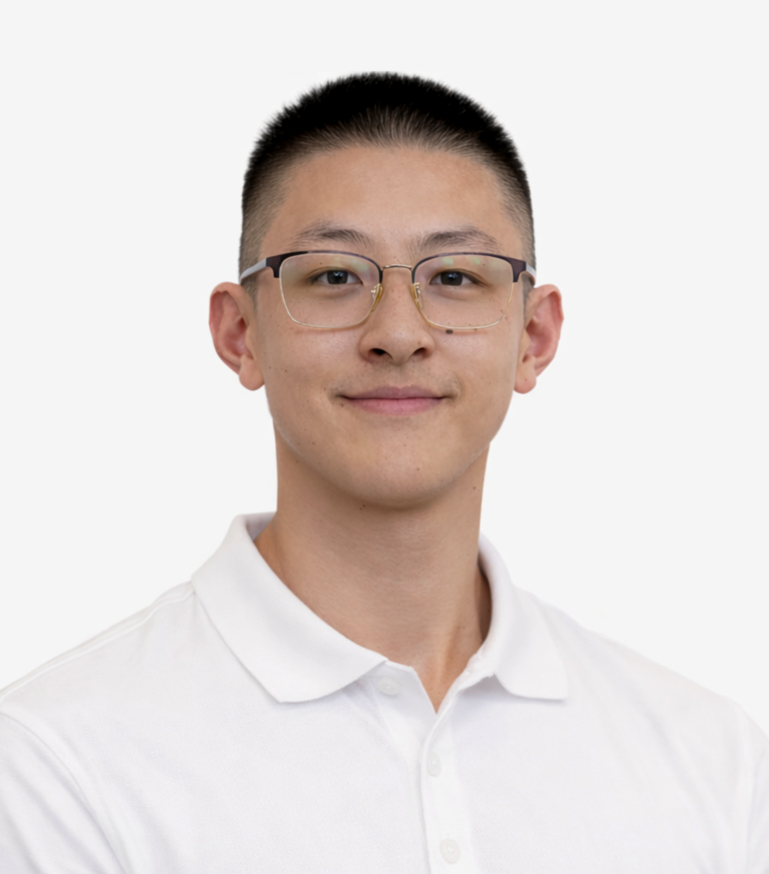 A well-built man with glasses with a well-groomed hair cut