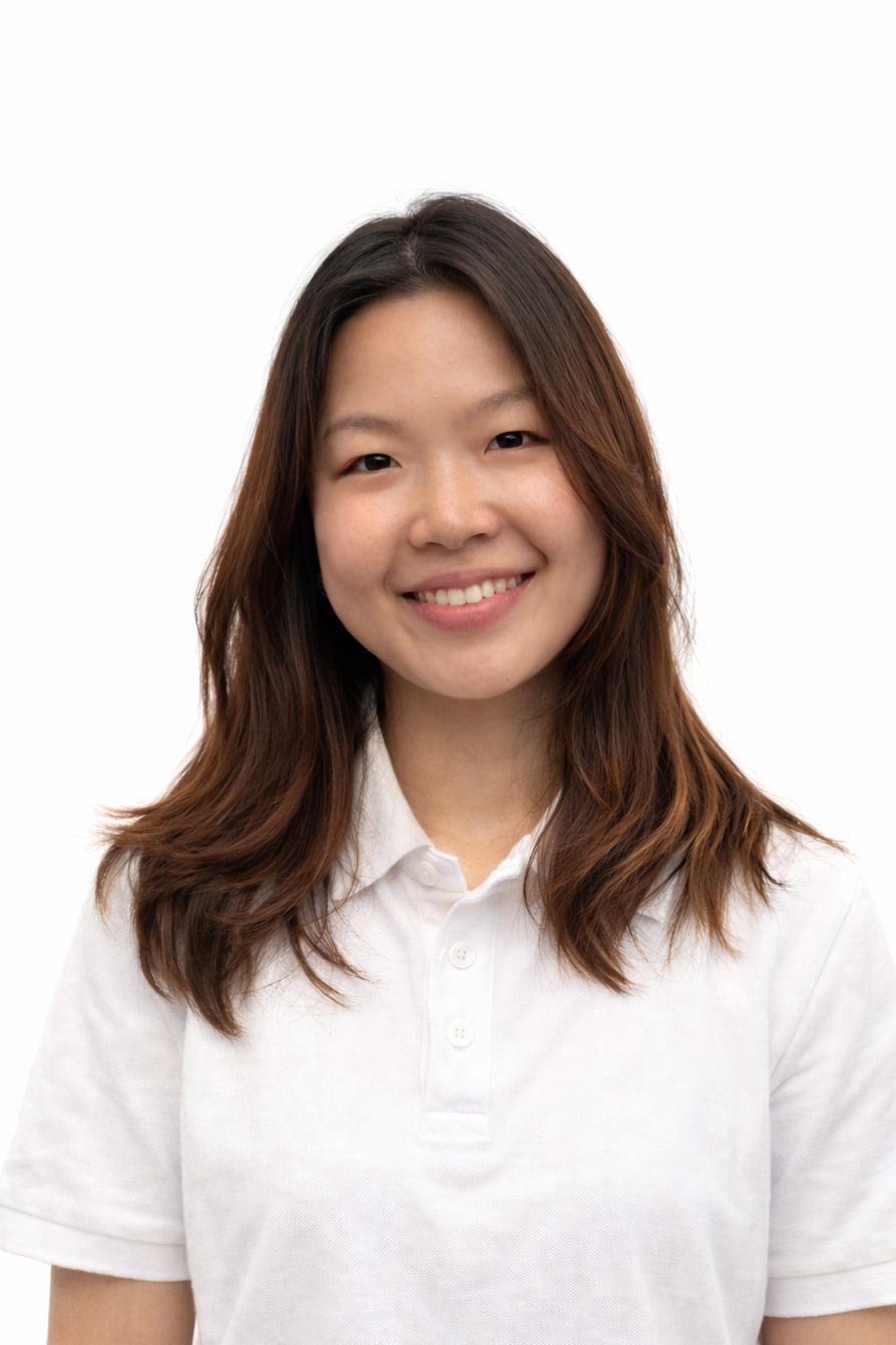 A lady with brown hair tilting her head slightly and smiling