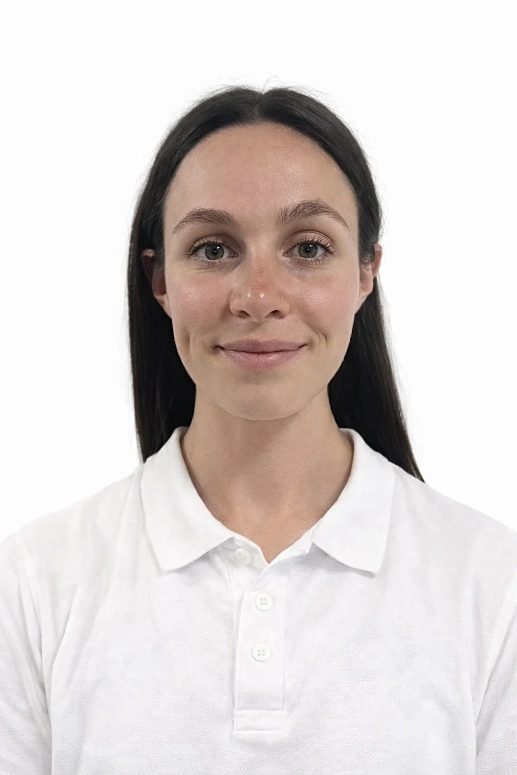 A dark haired lady in white polo smiling