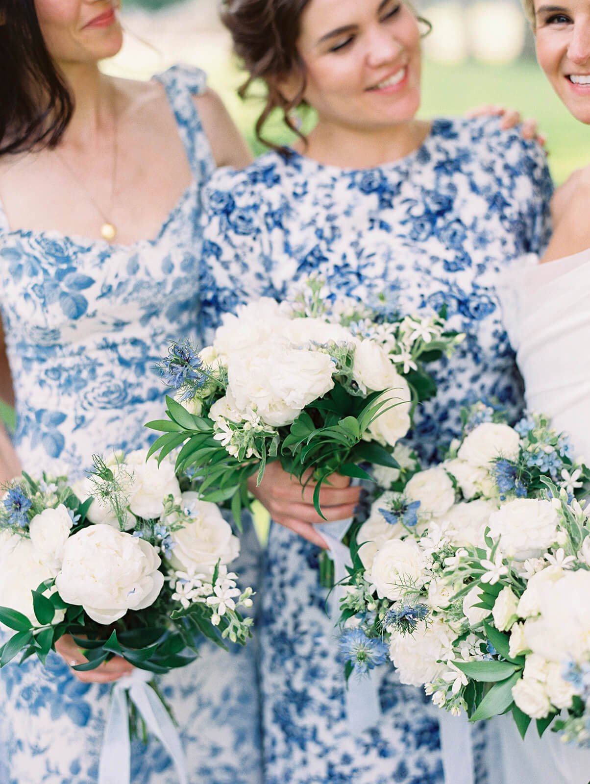 Blue floral bridesmaids dresses.