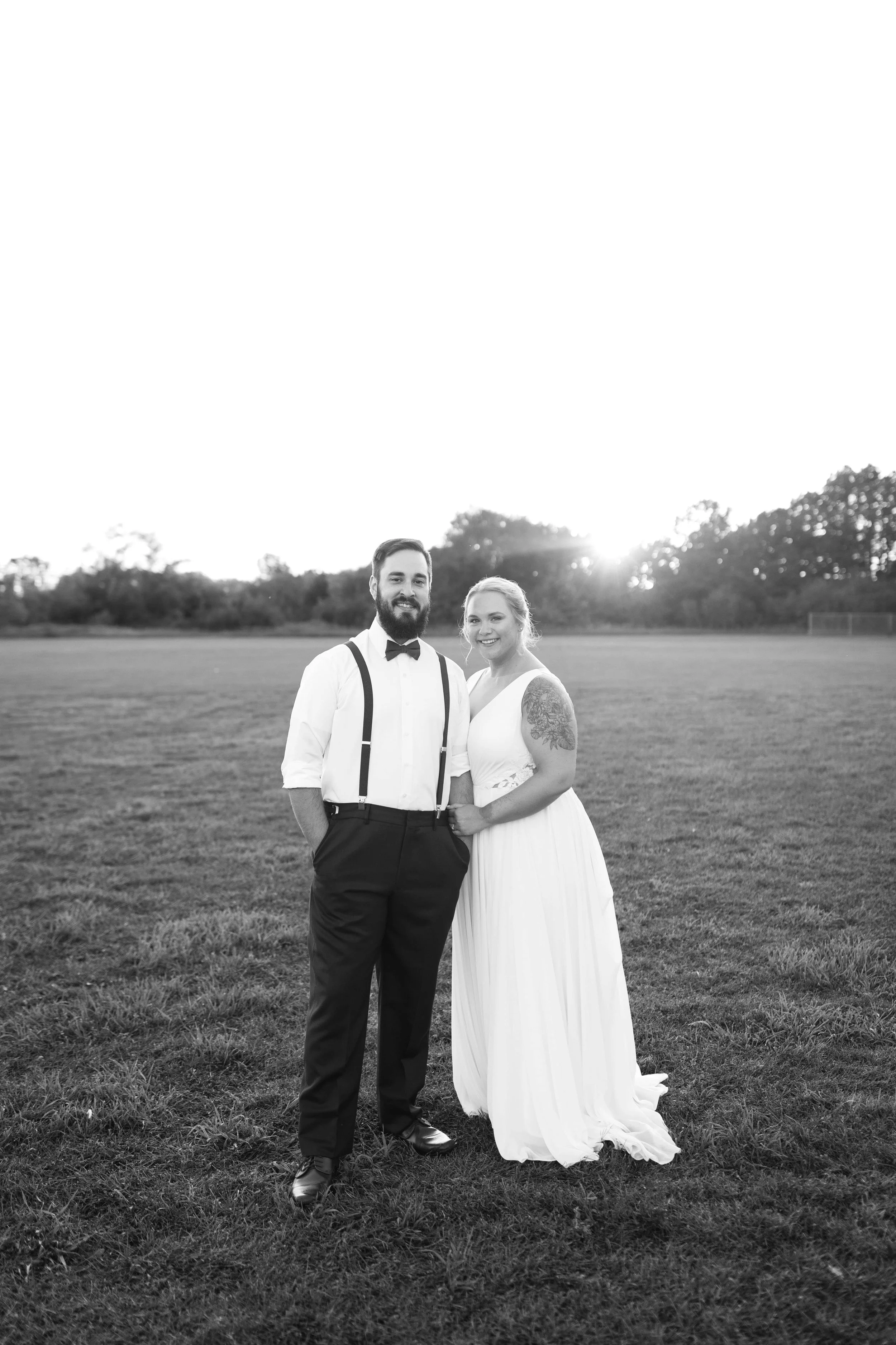 A Minnesota couple takes sunset portraits on their wedding day