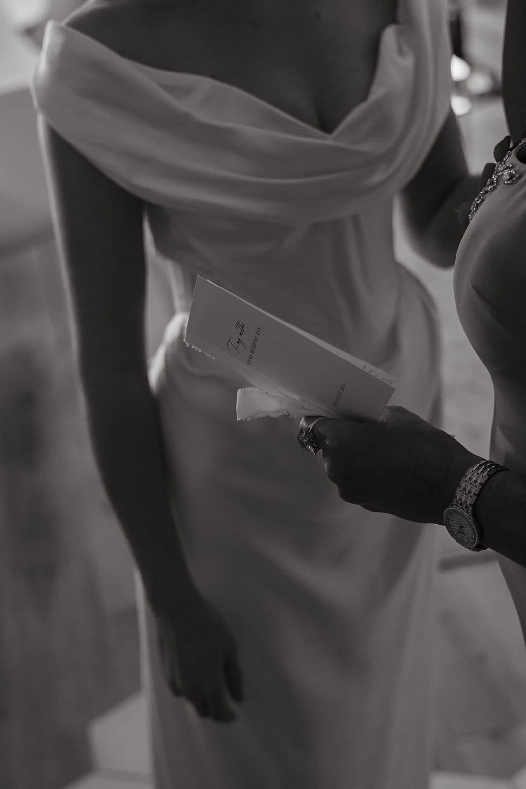 A black and white photo of a bride in her luxury gown from Vivienne Westwood