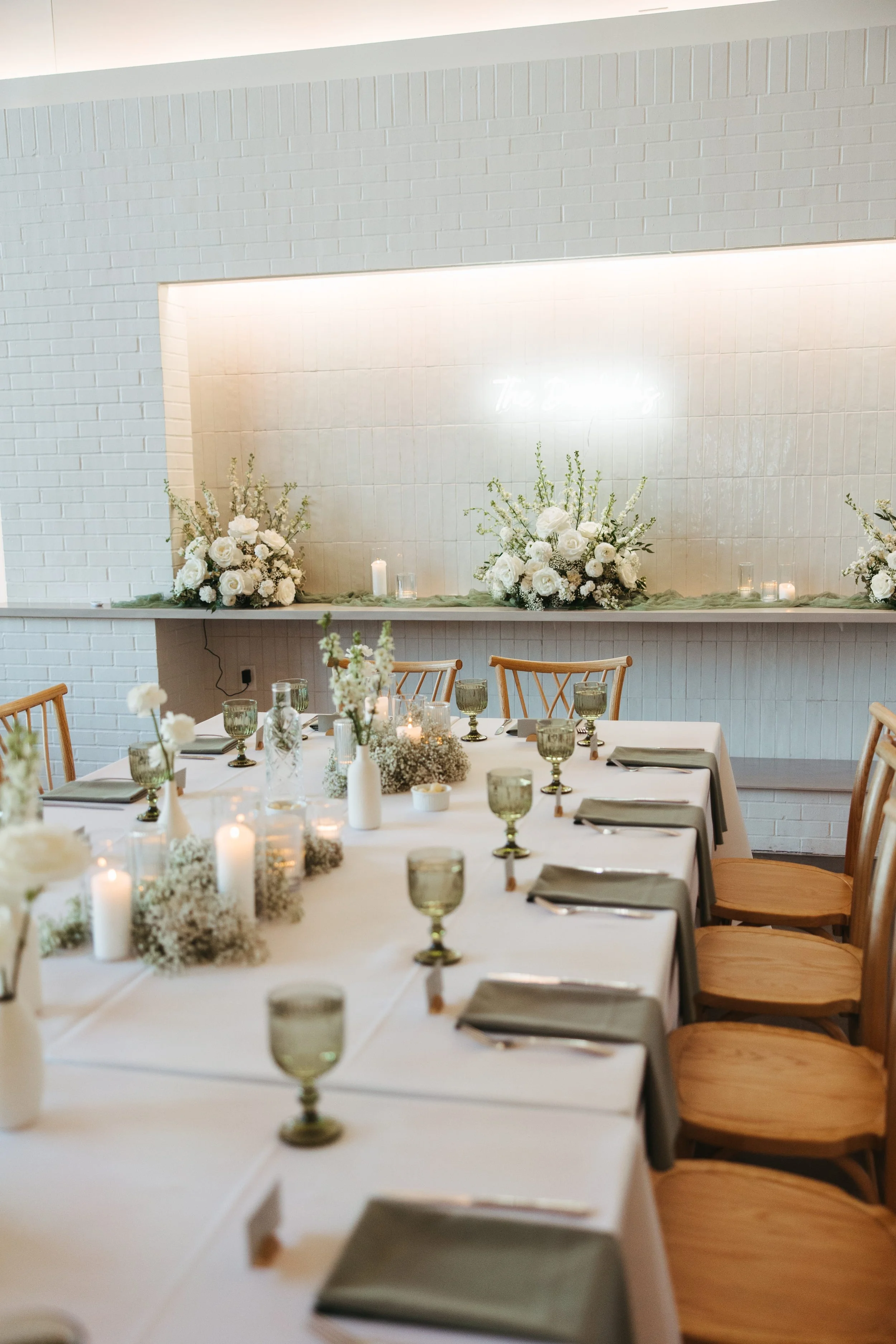 The head table at a White and Sable wedding reception.