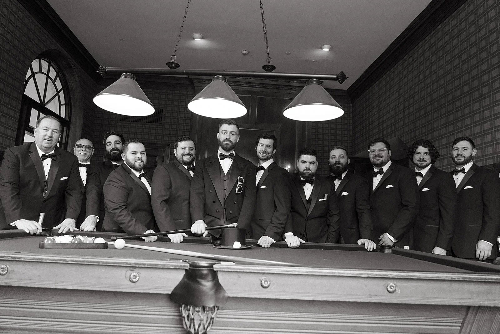 Groom and his groomsmen in the billards room at Tupper Manor