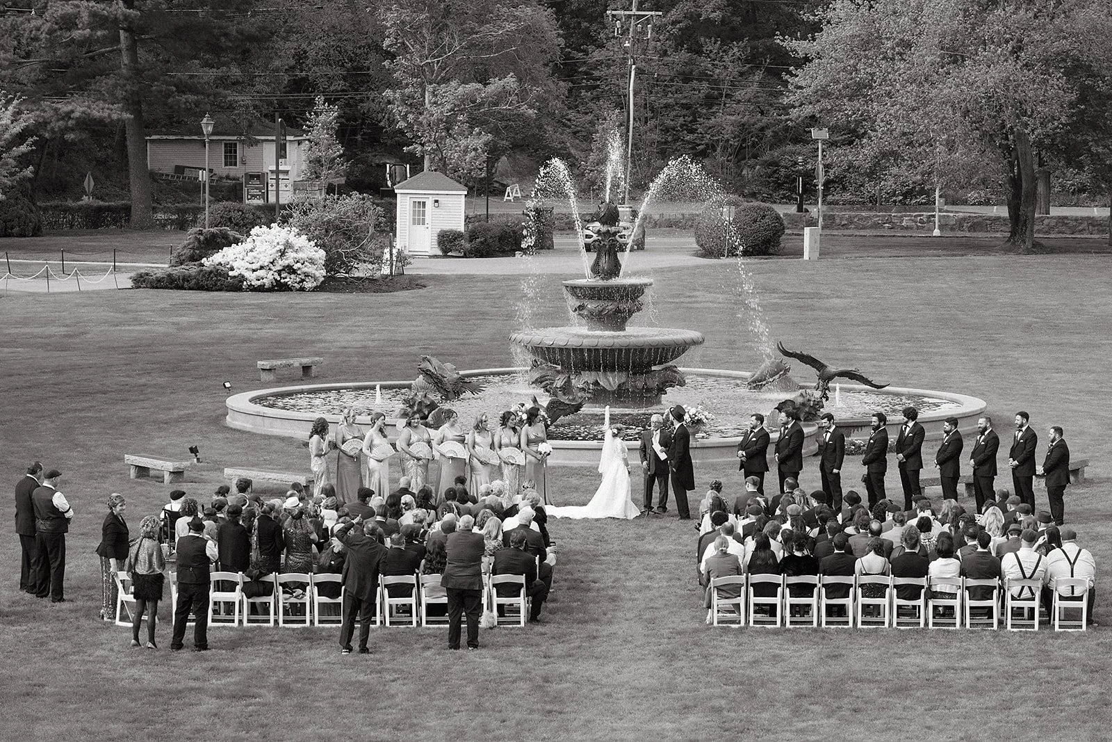 Outdoor wedding ceremony at Tupper Manor in Massachusetts, with the fountain in the background