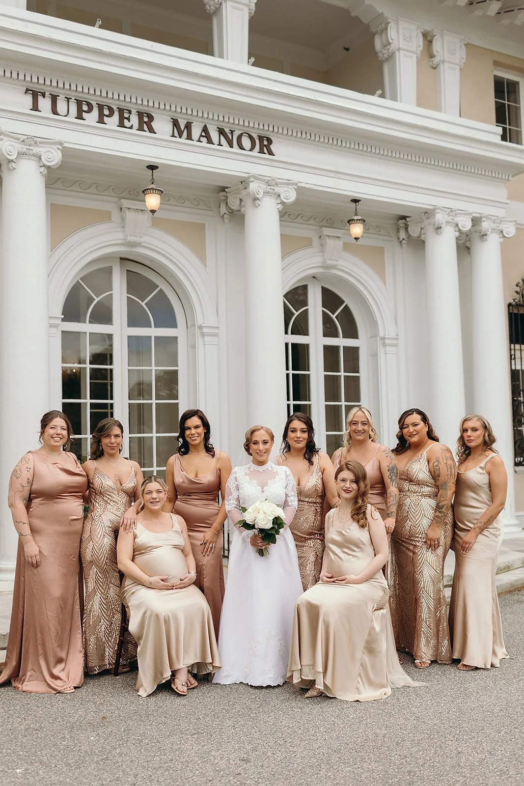 Bridesmaids in satin gowns in various shades of chamapgne and blush, for a wedding at Tupper Manor