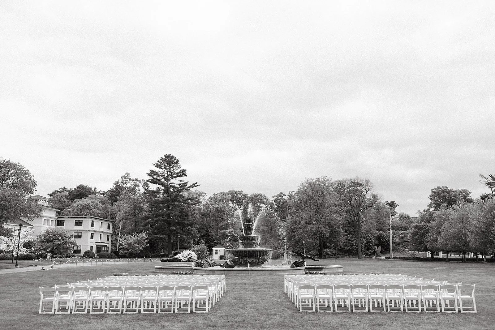 Outdoor wedding ceremony at Tupper Manor in Massachusetts, with the fountain in the background