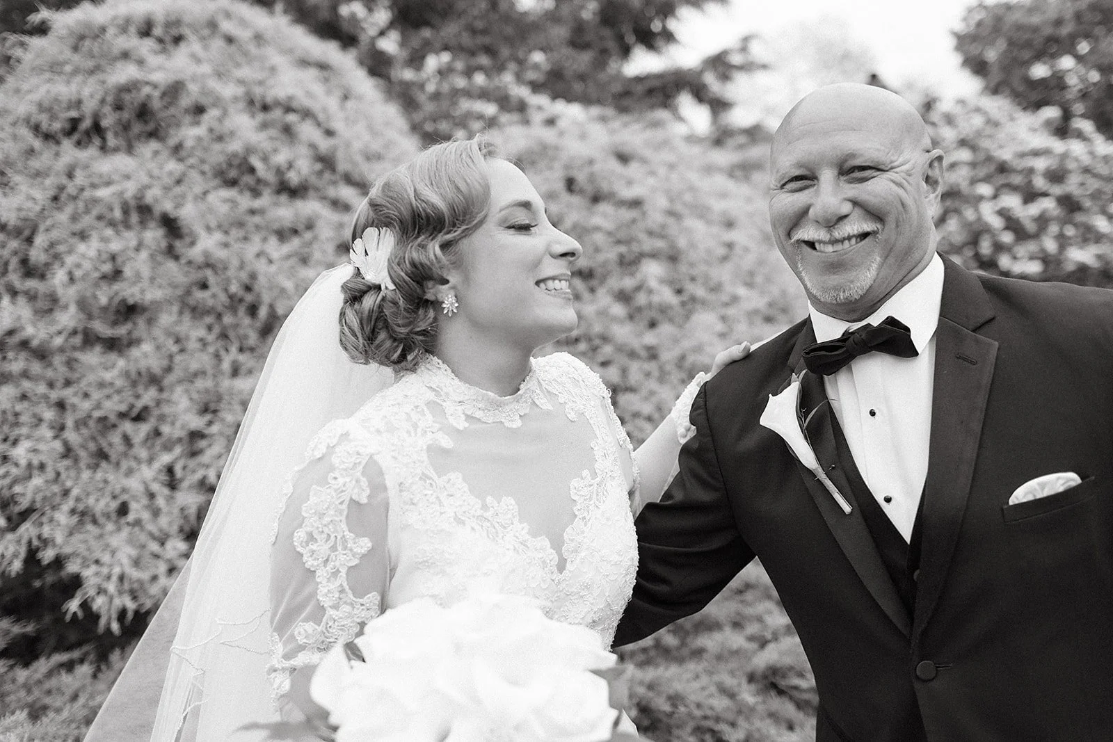 Bride and her father, laughing together
