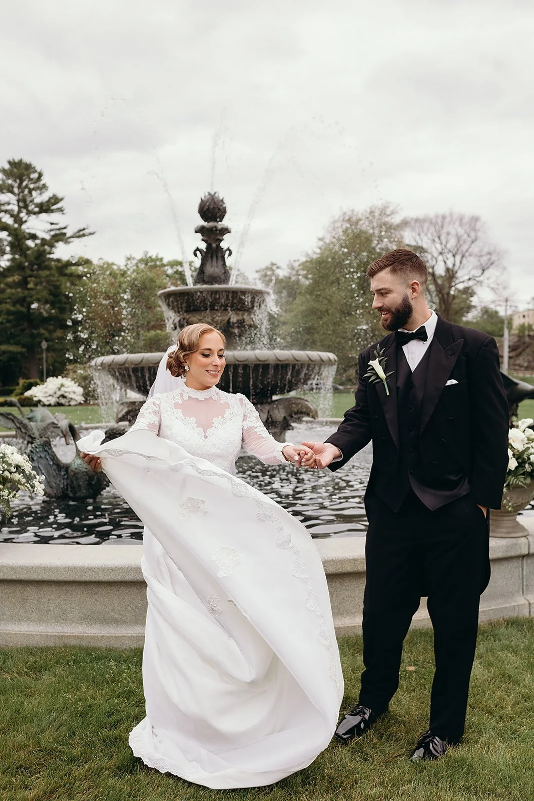 Bride and groom pictures on the lawns of Tupper Manor, with the fontain in the background