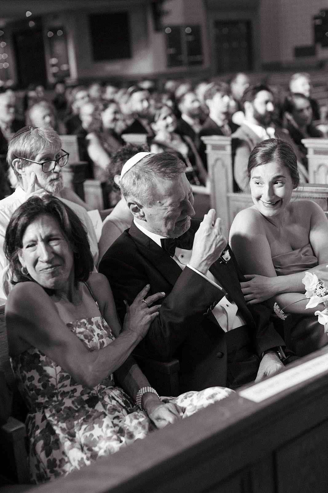A father of the bride crying as the couple exchanging vows at Temple Ohabei Shalom in Boston