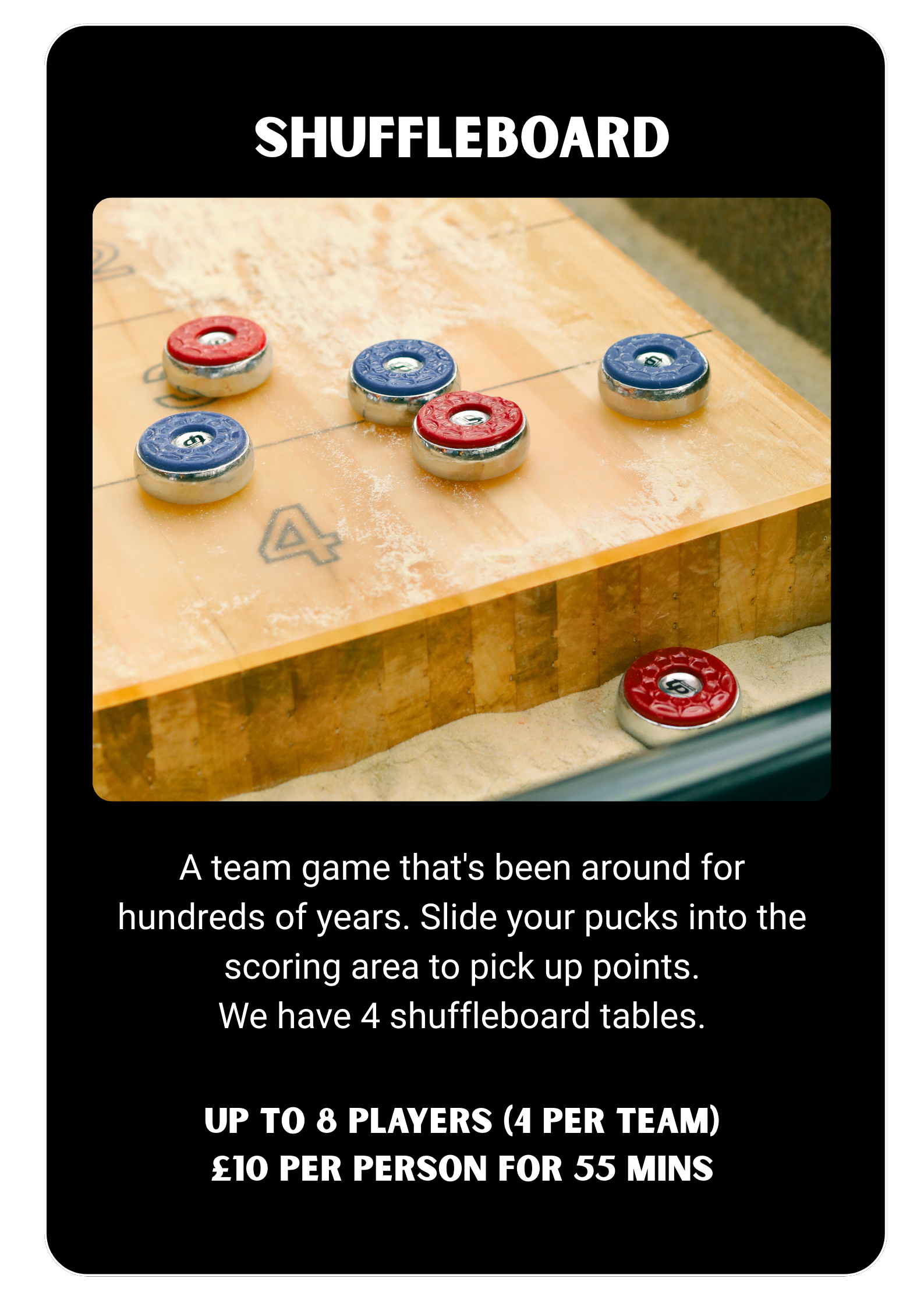 A shuffleboard table with red and blue pucks on a wooden surface, with some dust and markings. Players Social Cocktail and Games Bar Spitalfields Market. Cocktail classes in London
