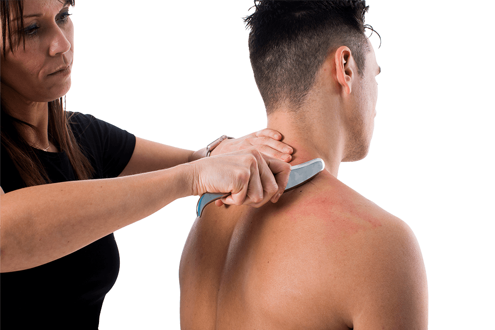 A woman appears to be butchering or scraping a man's back with a curved metal tool, and the man has visible redness or irritation on his skin.