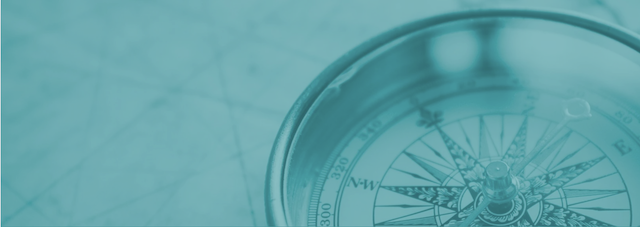 Close-up of a compass with a glass cover.