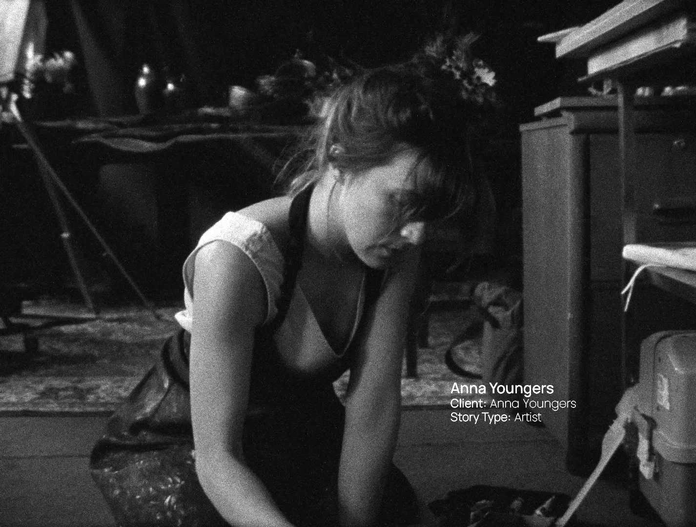 Black and white documentary still of artist Anna Youngers in her studio, a Passenger Productions client film