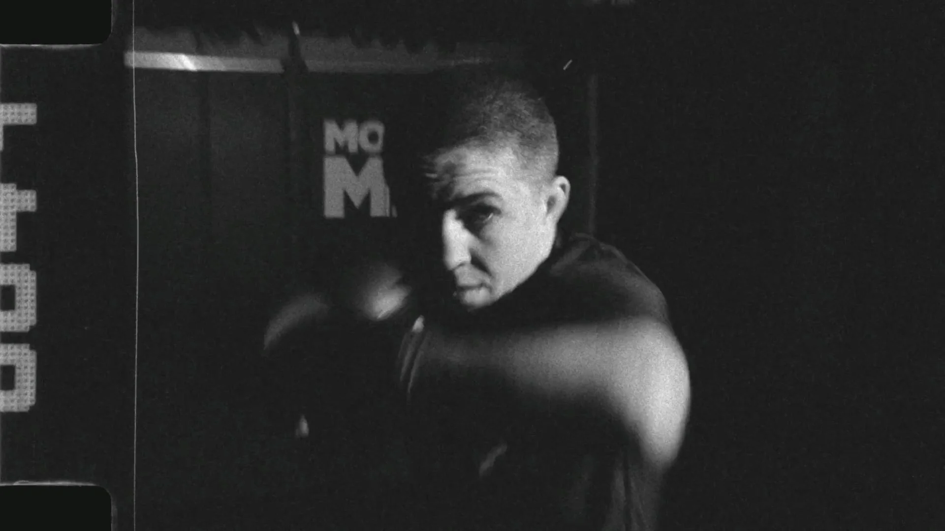 Black and white still of MMA fighter Chey Bowers training, from a Passenger Productions athletics documentary for Next Edge Academy