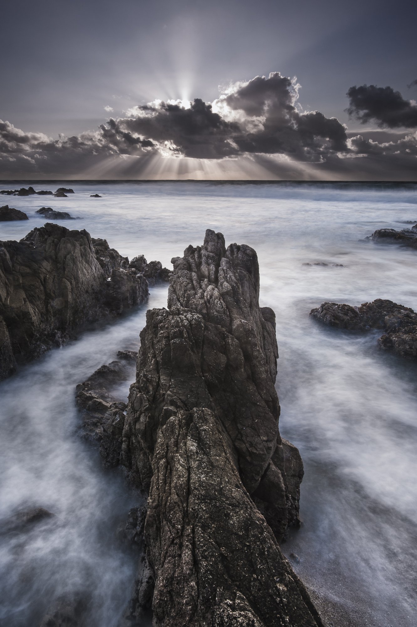 Dramatic coastal rock formation at sunset in Pacific Grove, California – fine art print by Jason Bradley