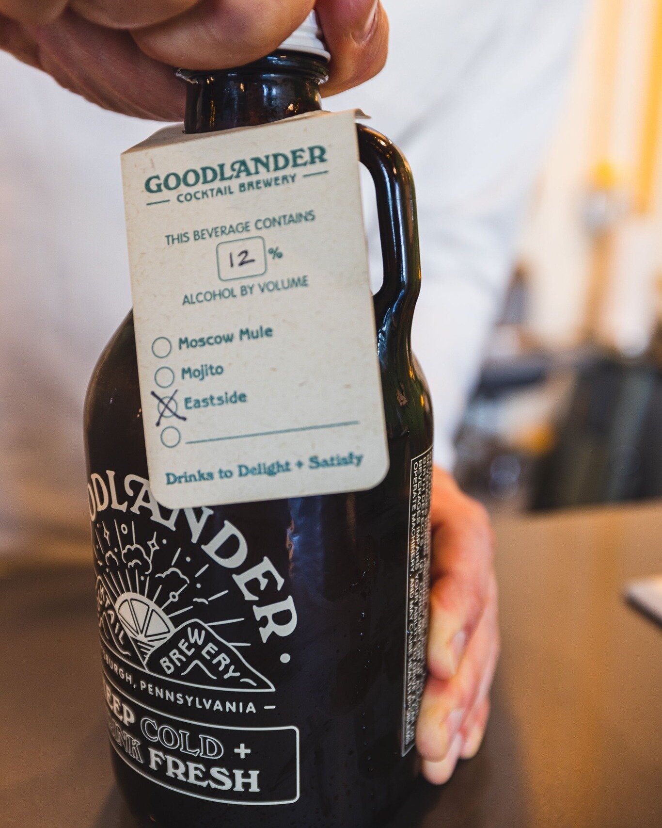 Check out these reusable, returnable growlers. Goodlander is out here, trying to take it forward by bringing it back. These 32-oz dark amber glass baddies protect your EASTSIDES (12% abv) from the sun and the wind, and also probably are a good defens