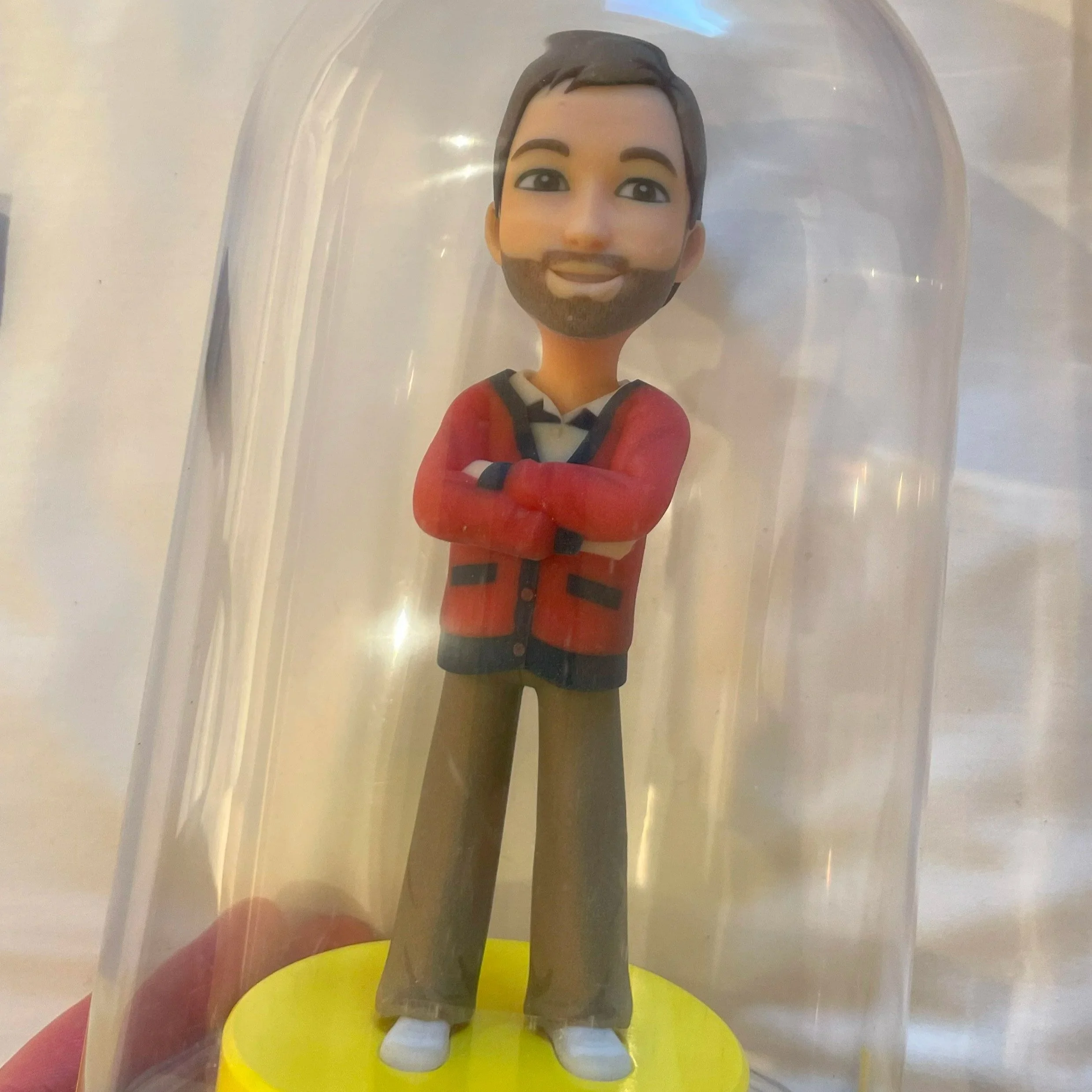Phil's bitmoji toy statue encased in a bubble.