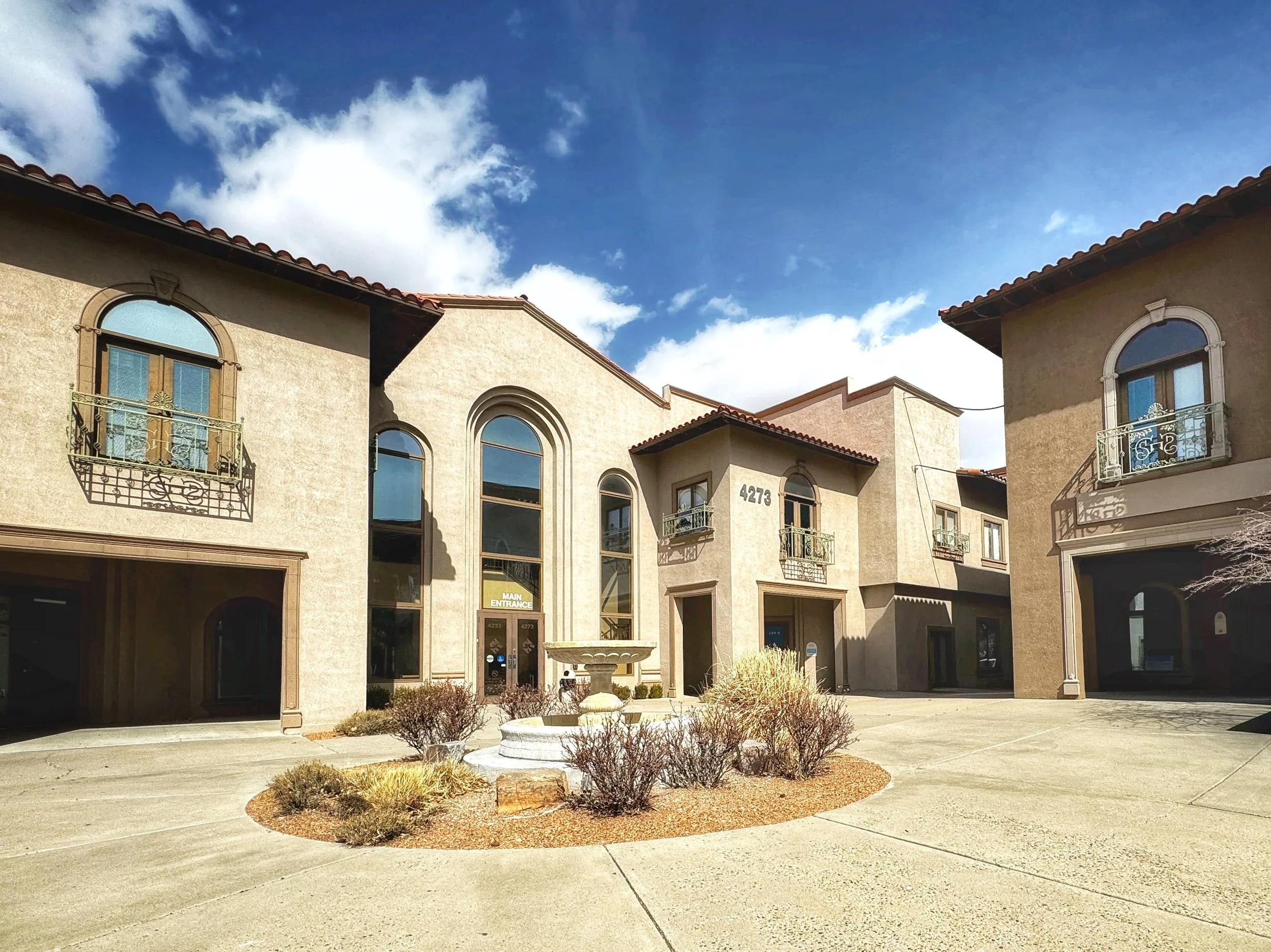 View of outside of building where Axces Albuquerque is located.